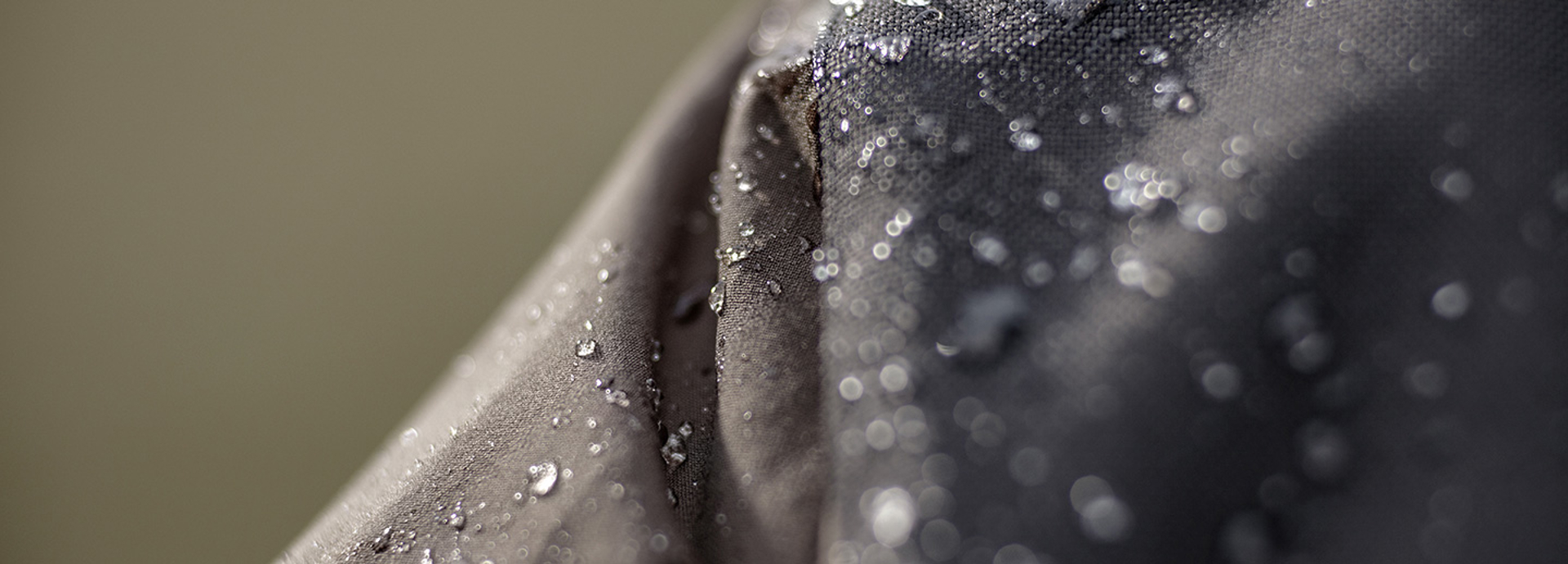 Closeup of fabric repelling water